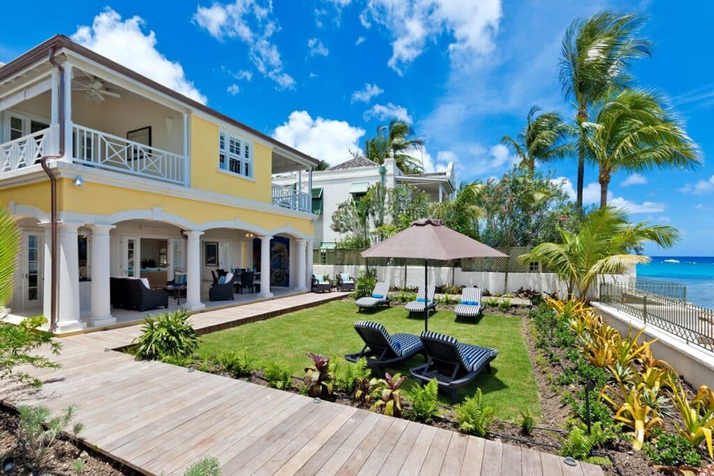 Beachfront garden with cushy loungers at the Ariel's Hideaway villa