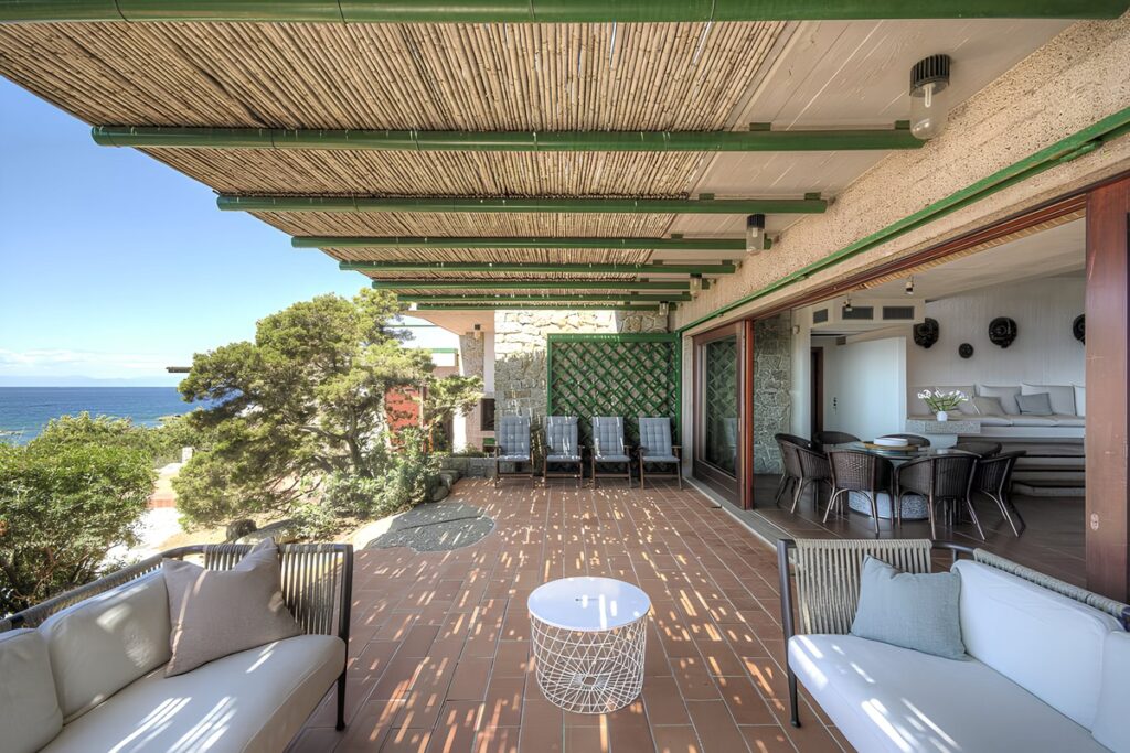 Covered terrace in the Mediterranean Dreams villa with sea views and Moroccan-inspired seating