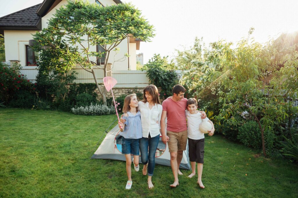 Happy family walking grass front tent outdoors 11zon