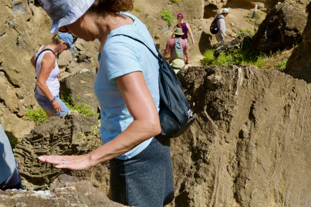 Original photo by paul partridge of a group hiking a rocky trail in the galápagos islands.