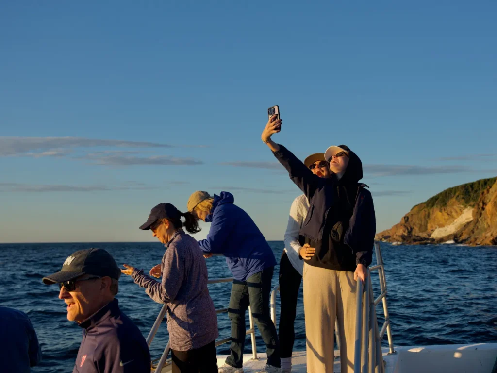 Original photo by paul partridge of travelers enjoying a boat trip in nova scotia.