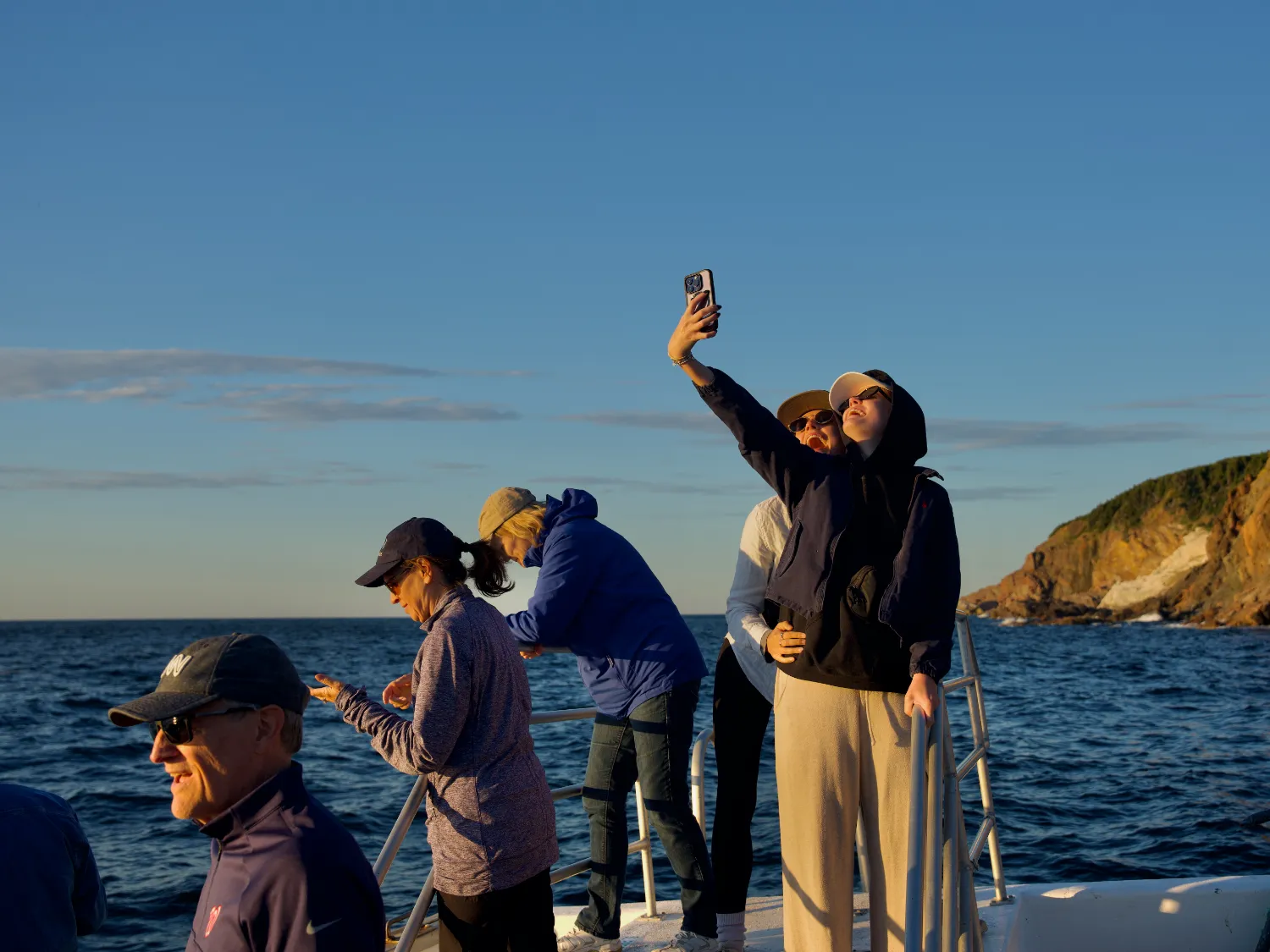 Original photo by Paul Partridge of travelers enjoying a boat trip in Nova Scotia.