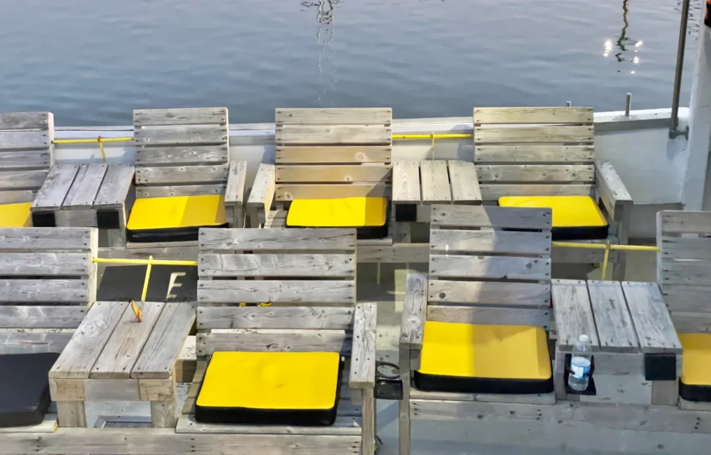 Wooden chairs on a fishing boat excursion in nova scotia, canada.