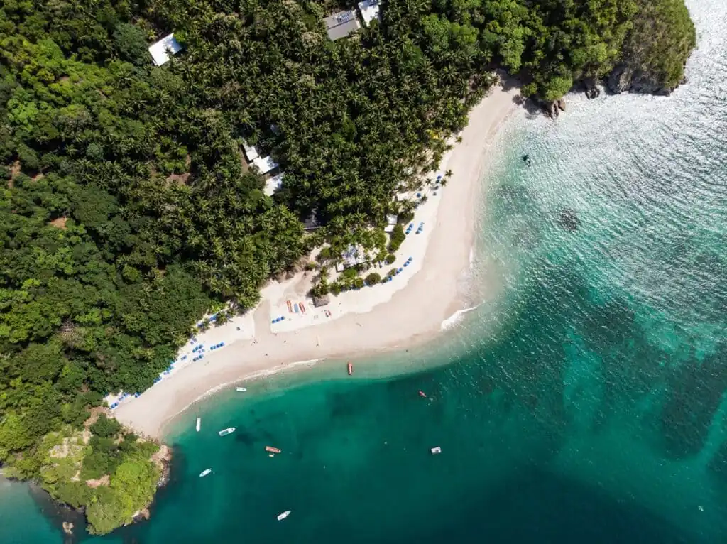 Aerial view of Isla Tortuga, Costa Rica, with boats along the coastline