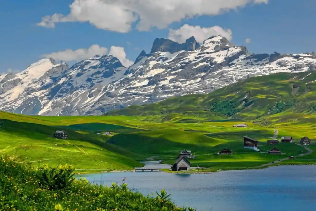 Swiss Alps in Switzerland with houses along the lake