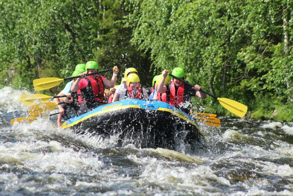A group of people enjoying a water rafting adventure