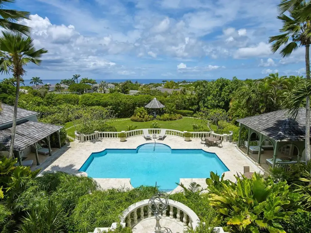 Aerial view of the pool with sun loungers at the tropical birds villa with a gazebo