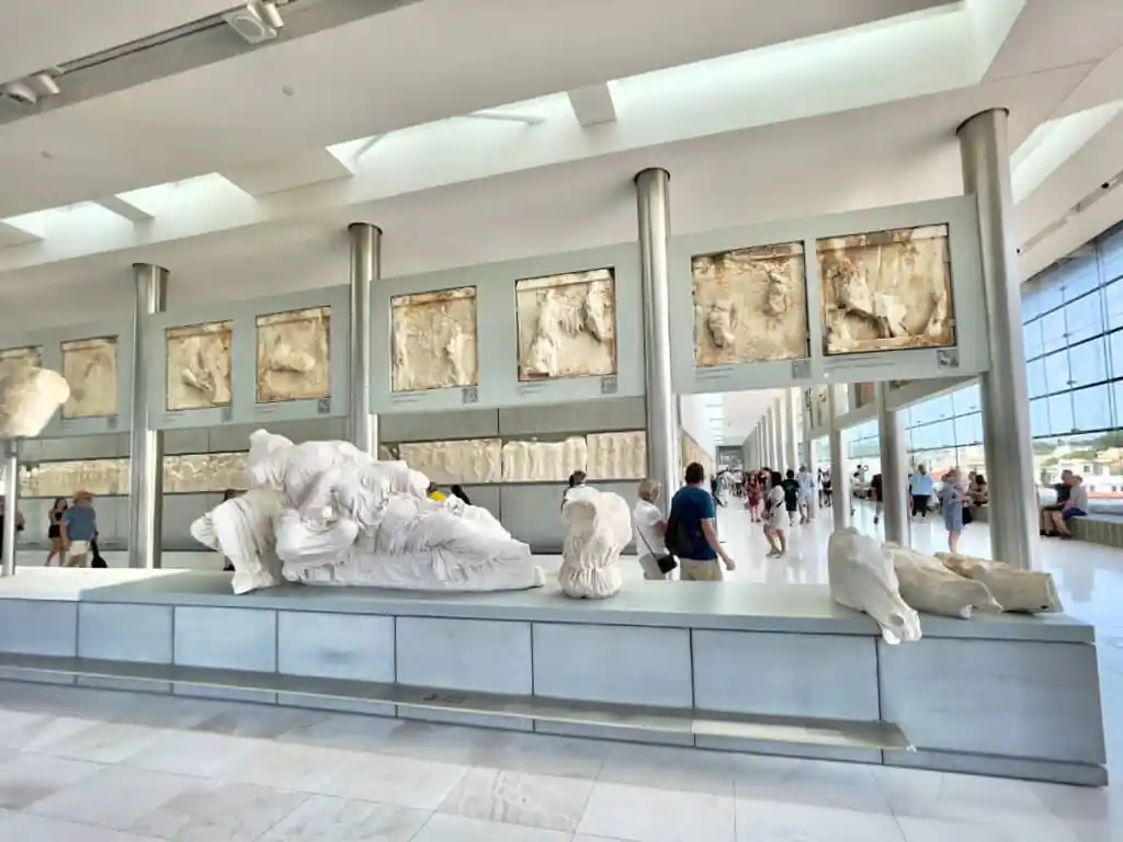 Original photo by paul partridge of the acropolis museum’s modern gallery in athens, with marble sculpture fragments on display.