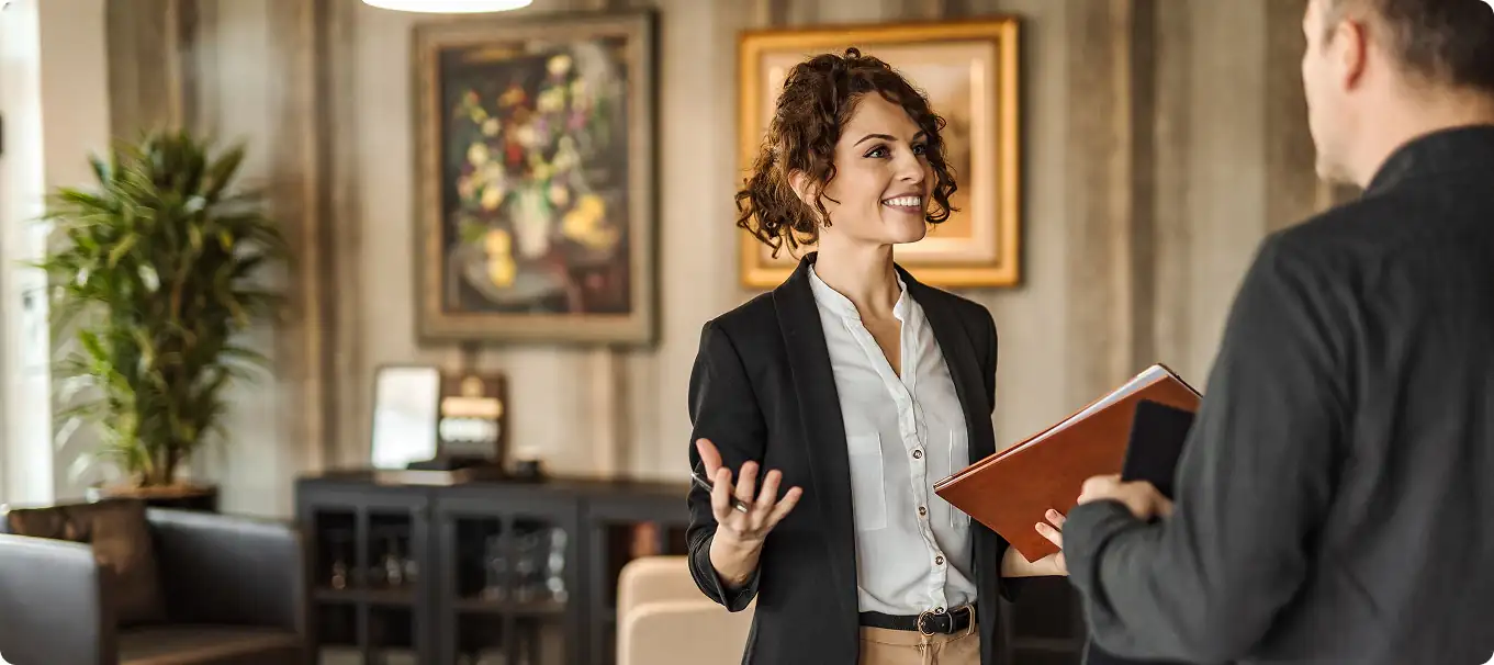 Dedicated concierge assisting a guest at a private luxury villa during a milestone celebration.