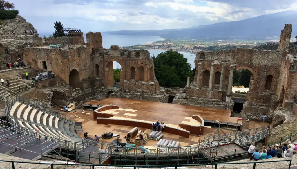 Ancient Greek Theater in Taormina, Sicily, with panoramic views of the Ionian coast.