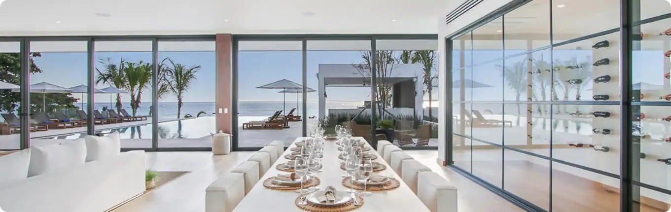 Exquisitely-arranged dining table at a caribbean private villa with spectacular ocean views during a girlfriends' getaway.